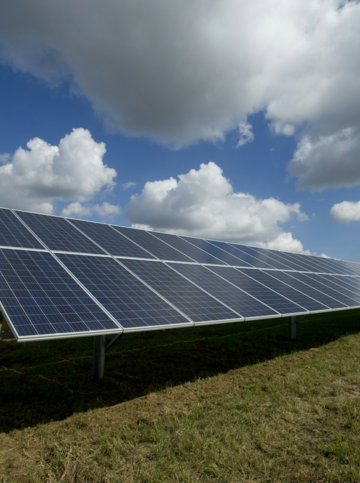 solar-panels-on-green-field.jpg solar panels on green field